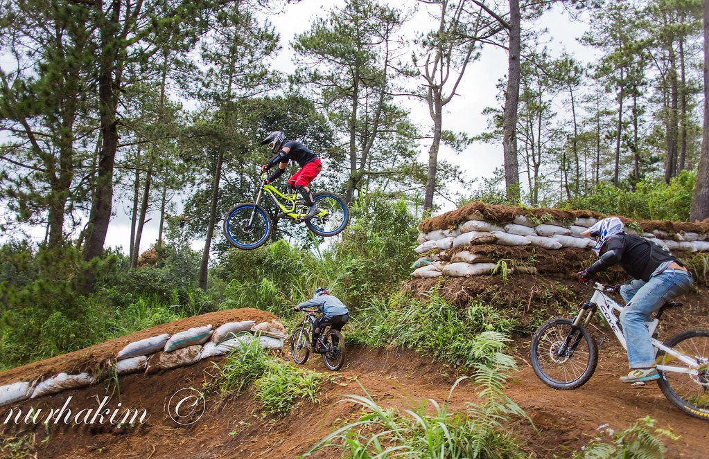 Mountain bike rider doing a gap jump
